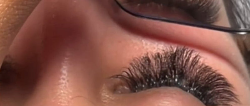 A finished set of lash extensions, eye closed
